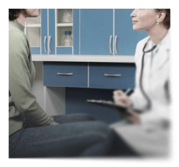 female doctor in a white coat with a stethoscope consulting with a patient in a medical office