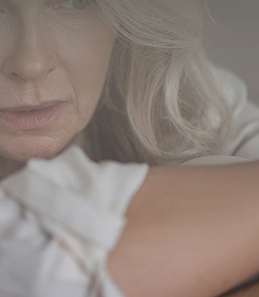 pensive older woman closeup thoughtful expression